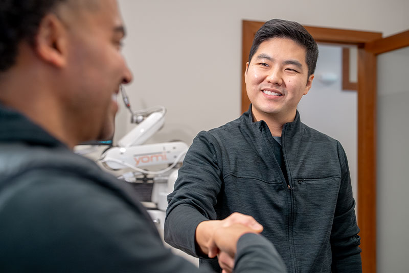 dr with tj shaking hands